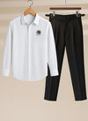 White shirt with a logo and black pants