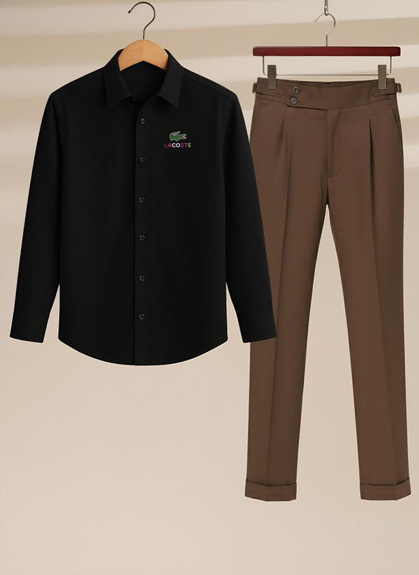Black shirt with green logo and brown pants