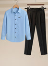 Light blue shirt with Nike logo and black pants