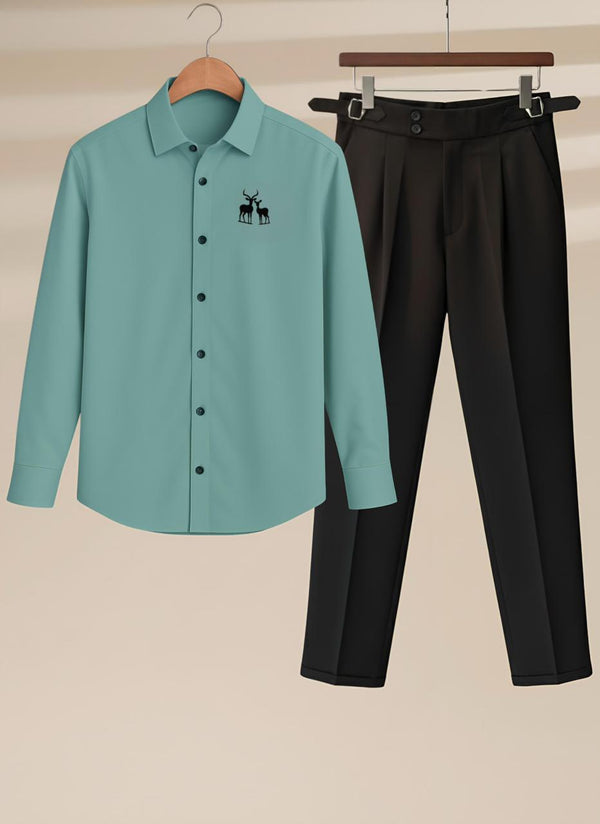 Teal shirt with a logo and black pants